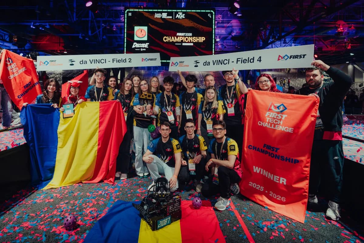 Team Velocity with their robot, Romanian flag and FIRST Championship 2026 trophy